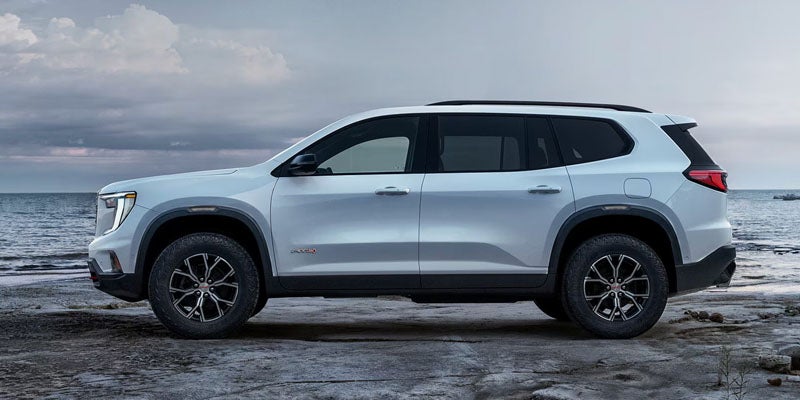 2026 GMC Acadia side view by water